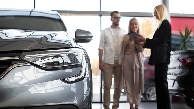 Customers at a car dealership